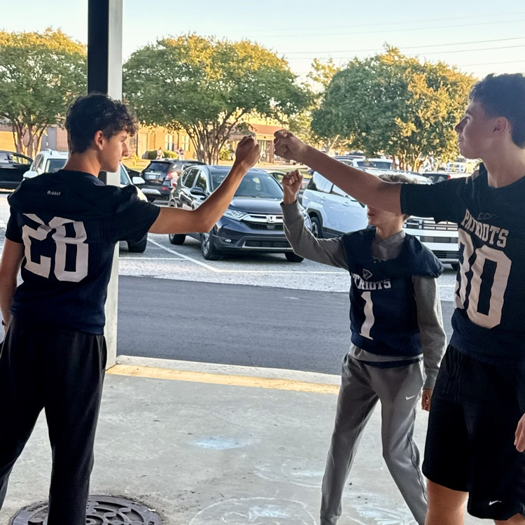 football players fist bumping 
