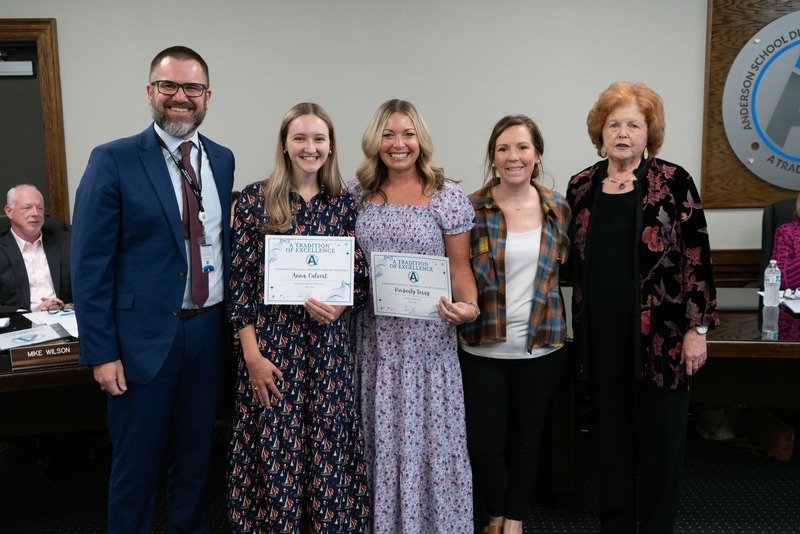 The Anderson One Superintendent and Board Chair Nancy Upton pose for a photo with the Employees of the Year: Kimberly Terry, Holly Ragsdale, and Anna Calvert