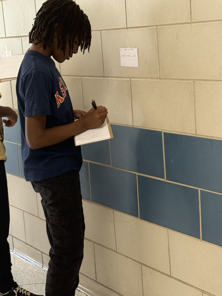 Who says math review can't be an adventure? Our 5th graders took their learning to the hallway for a gallery walk, working through task cards posted on the walls. This innovative method keeps students active and excited about reinforcing their math skills. It's awesome to see them so focused and ready to learn!