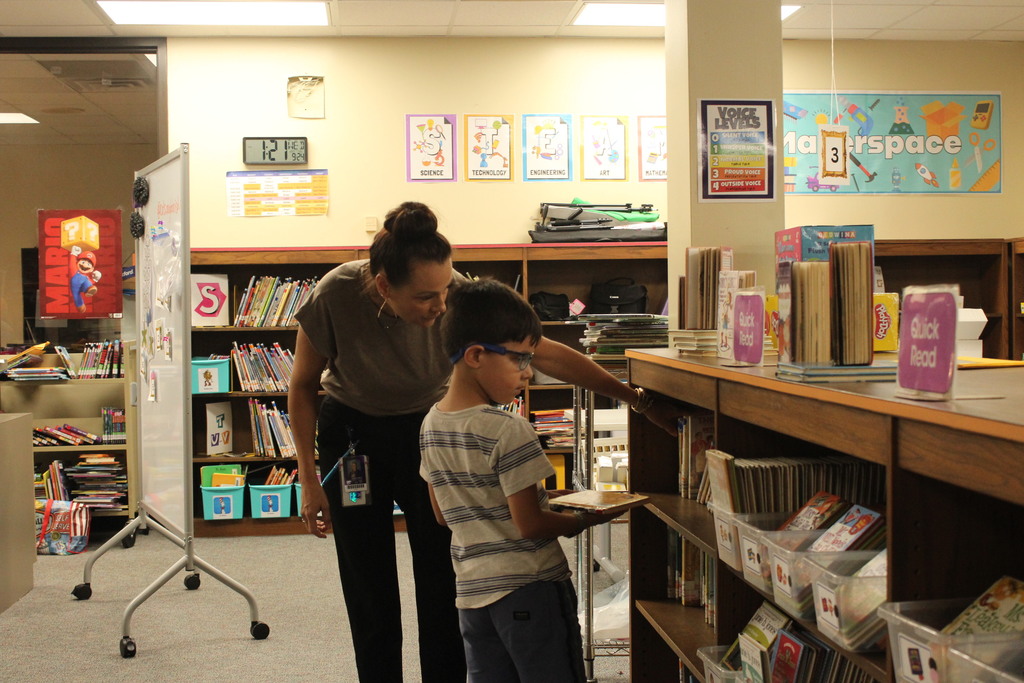 It's a great day to find a new story! Mrs. Aleman's first grade students are finding their own books and settling in to read. These are the moments where a love for reading begins to grow! #ReadersAreLeaders #SchoolLife #Bookworm