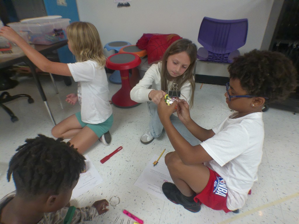 "Science in Action! Our 4th graders in Mrs. Edwards' class were hard at work today exploring non-contact forces like magnetism! They were challenged to make a car move without ever touching it. Talk about an engaging way to learn about how the world works! We love seeing our students become real-life investigators.