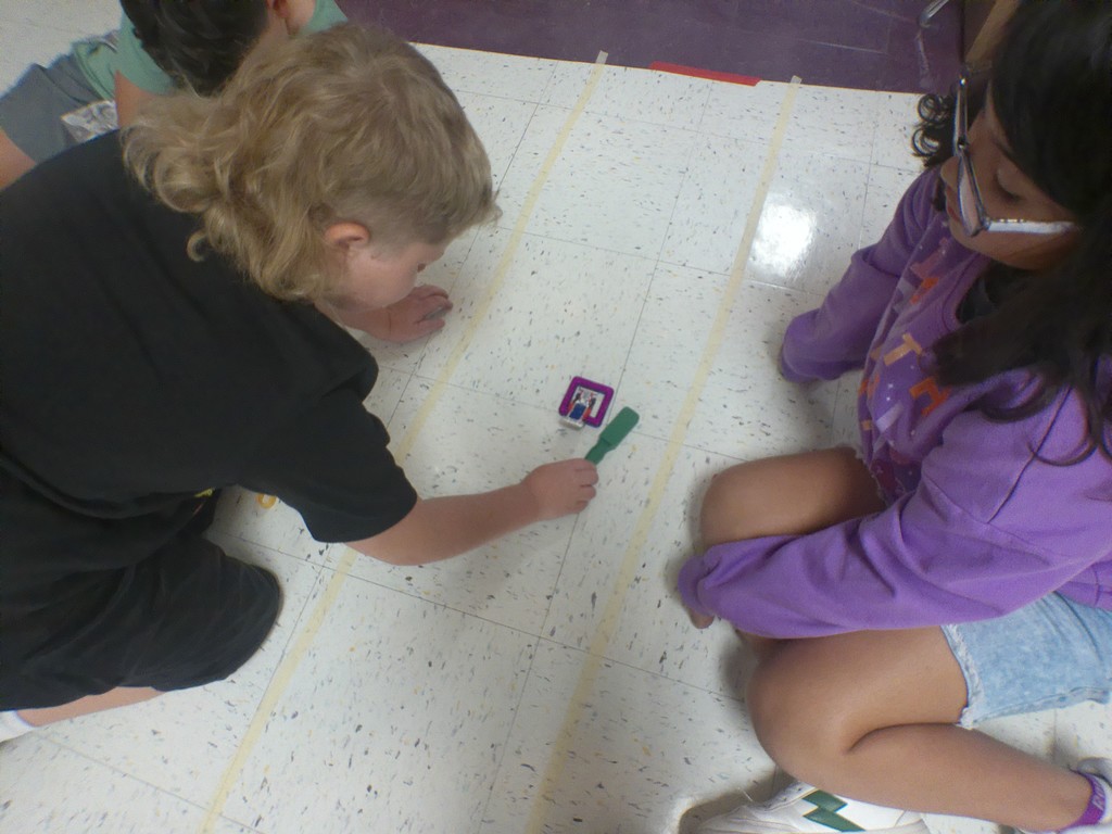 "Science in Action! Our 4th graders in Mrs. Edwards' class were hard at work today exploring non-contact forces like magnetism! They were challenged to make a car move without ever touching it. Talk about an engaging way to learn about how the world works! We love seeing our students become real-life investigators.