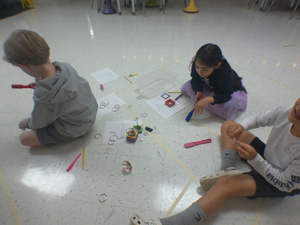 "Science in Action! Our 4th graders in Mrs. Edwards' class were hard at work today exploring non-contact forces like magnetism! They were challenged to make a car move without ever touching it. Talk about an engaging way to learn about how the world works! We love seeing our students become real-life investigators.