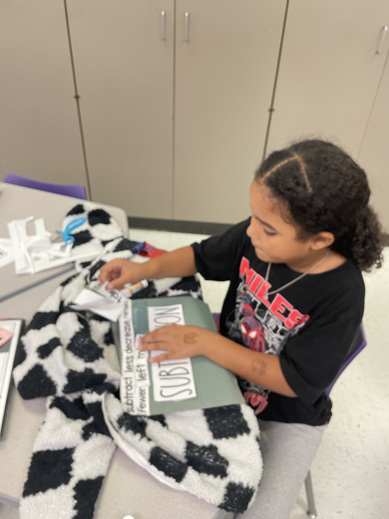 Our fantastic 2nd graders are building a strong foundation in math by getting hands on with vocabulary practice. They were cutting and sorting key words like 'subtract,' 'decrease,' and 'plus,' making abstract concepts concrete and memorable. We love seeing this level of focus and engagement in the classroom every day!