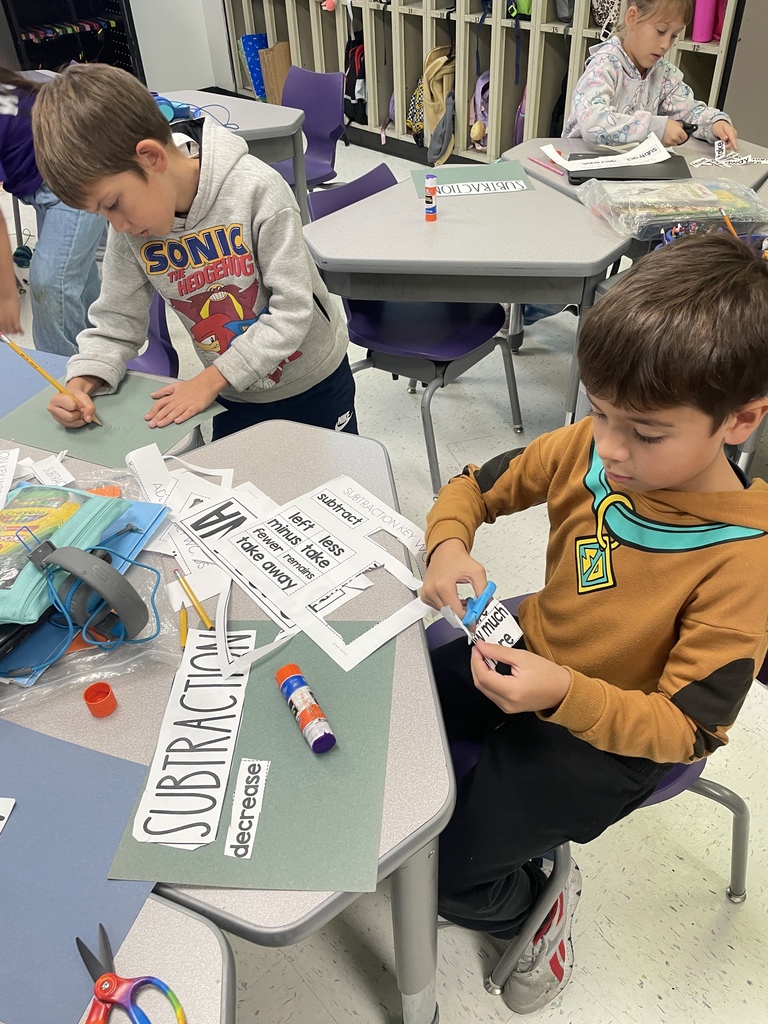 Our fantastic 2nd graders are building a strong foundation in math by getting hands on with vocabulary practice. They were cutting and sorting key words like 'subtract,' 'decrease,' and 'plus,' making abstract concepts concrete and memorable. We love seeing this level of focus and engagement in the classroom every day!