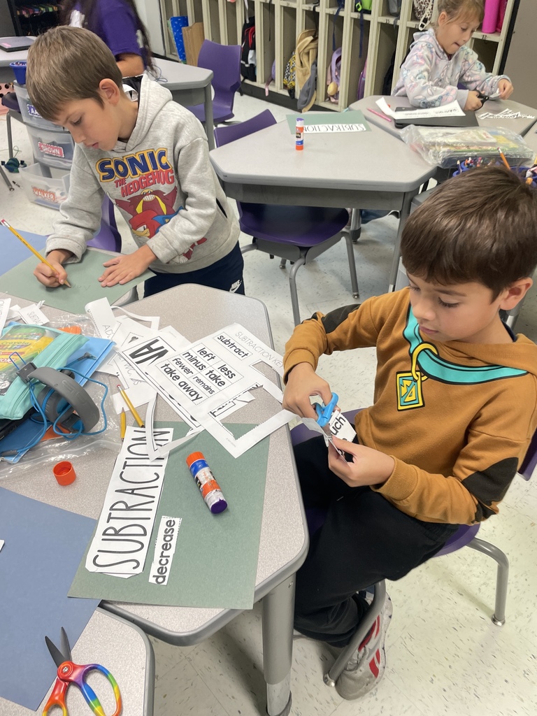 Our fantastic 2nd graders are building a strong foundation in math by getting hands on with vocabulary practice. They were cutting and sorting key words like 'subtract,' 'decrease,' and 'plus,' making abstract concepts concrete and memorable. We love seeing this level of focus and engagement in the classroom every day!