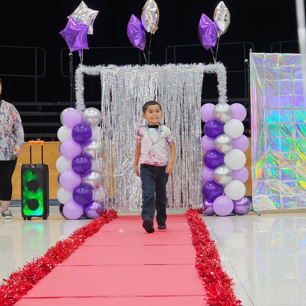 Learning comes to life in Pre-K! Their recent Clothing Unit culminated in a fabulous Fashion Show, reinforcing everything from sorting by color and texture to developing essential self-help skills like buttoning and zipping.  Our students got to put their vocabulary and classification skills into action as they became designers and models for the day. A huge shoutout to our students for their creativity and our amazing teachers for making learning so tangible!