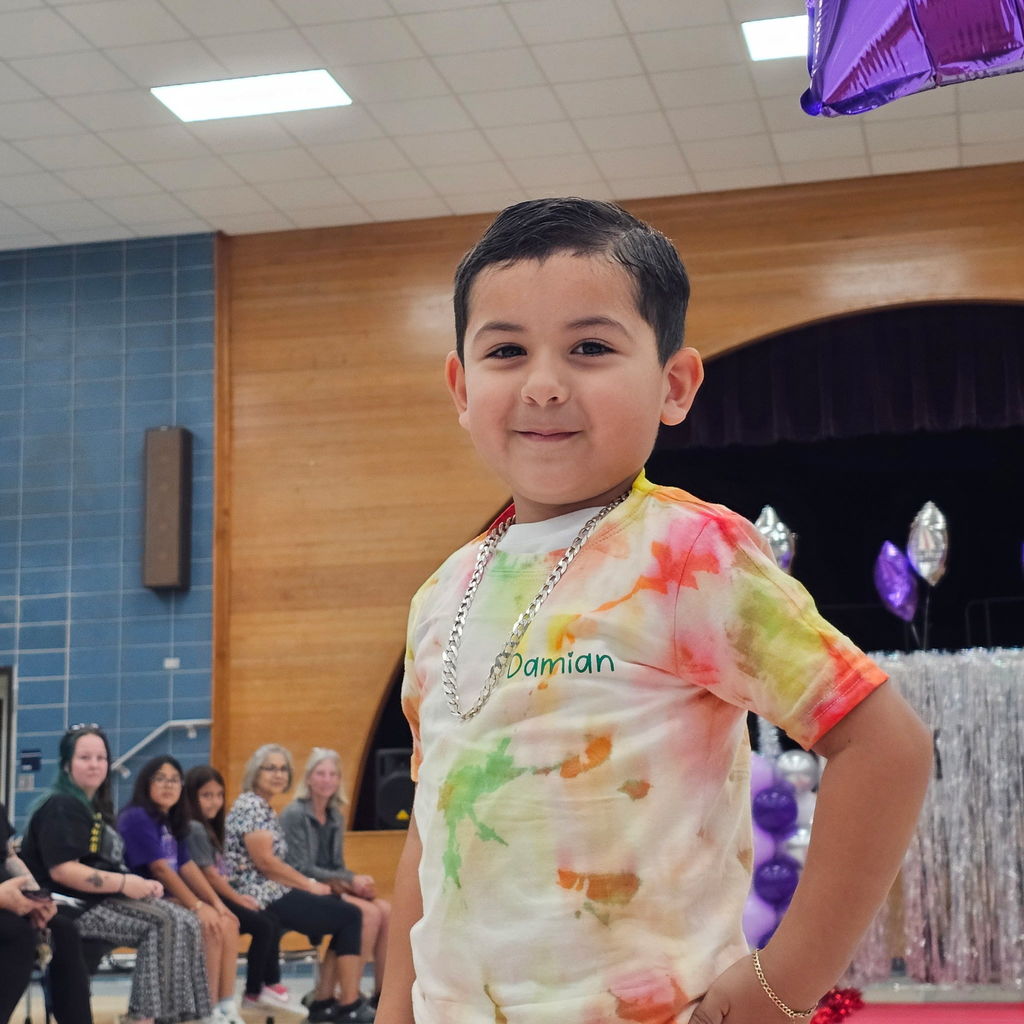 Learning comes to life in Pre-K! Their recent Clothing Unit culminated in a fabulous Fashion Show, reinforcing everything from sorting by color and texture to developing essential self-help skills like buttoning and zipping.  Our students got to put their vocabulary and classification skills into action as they became designers and models for the day. A huge shoutout to our students for their creativity and our amazing teachers for making learning so tangible!