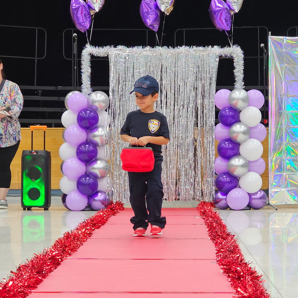 Learning comes to life in Pre-K! Their recent Clothing Unit culminated in a fabulous Fashion Show, reinforcing everything from sorting by color and texture to developing essential self-help skills like buttoning and zipping.  Our students got to put their vocabulary and classification skills into action as they became designers and models for the day. A huge shoutout to our students for their creativity and our amazing teachers for making learning so tangible!