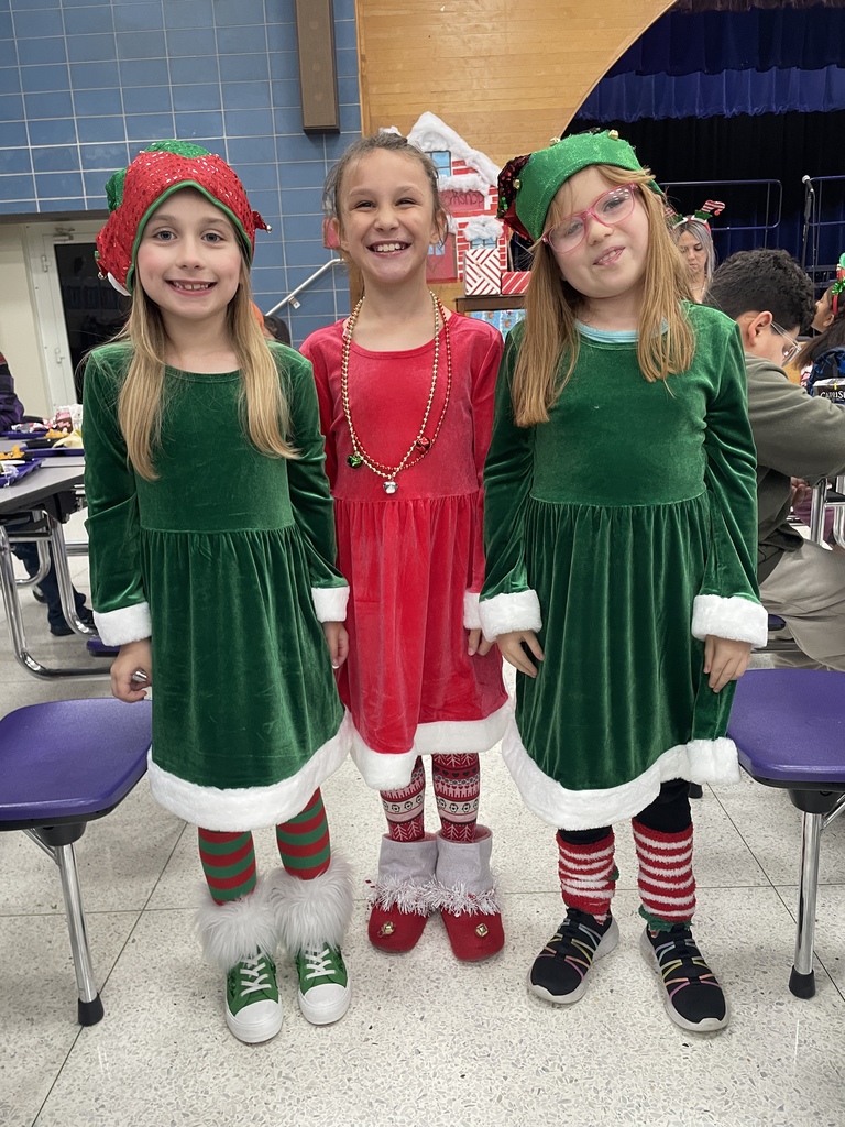 "Selfie with an Elfie! Our halls are officially under elf surveillance today! From sparkly sequins to striped socks, our students and staff definitely understood the assignment. We love seeing so much creativity and joy walking through the school!  Reminder: Don't forget that tomorrow is Rudolph/Reindeer Day!