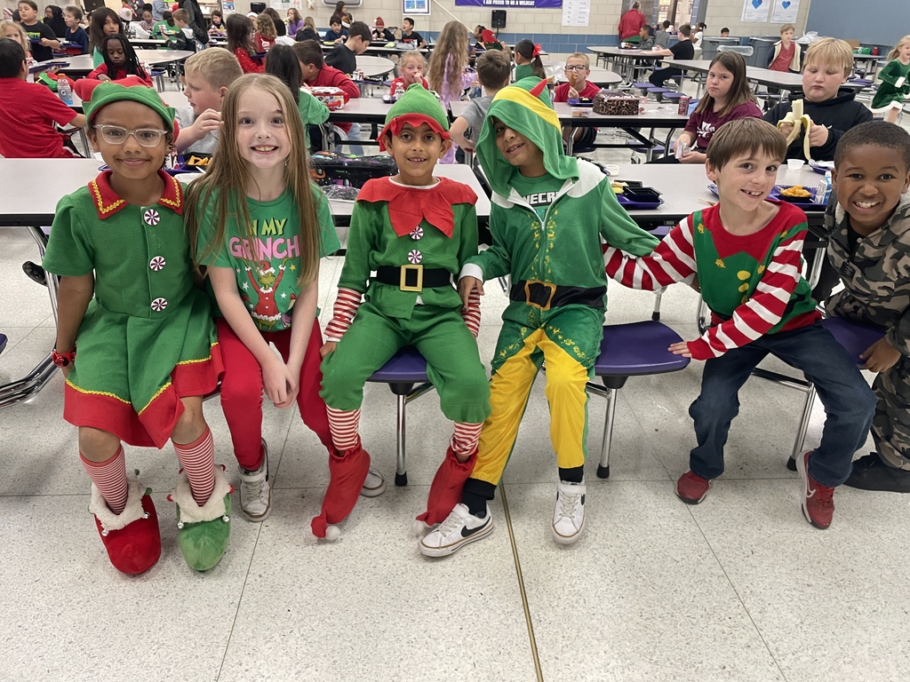 "Selfie with an Elfie! Our halls are officially under elf surveillance today! From sparkly sequins to striped socks, our students and staff definitely understood the assignment. We love seeing so much creativity and joy walking through the school!  Reminder: Don't forget that tomorrow is Rudolph/Reindeer Day!