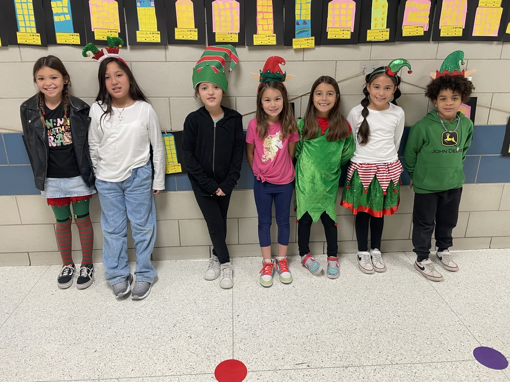 "Selfie with an Elfie! Our halls are officially under elf surveillance today! From sparkly sequins to striped socks, our students and staff definitely understood the assignment. We love seeing so much creativity and joy walking through the school!  Reminder: Don't forget that tomorrow is Rudolph/Reindeer Day!