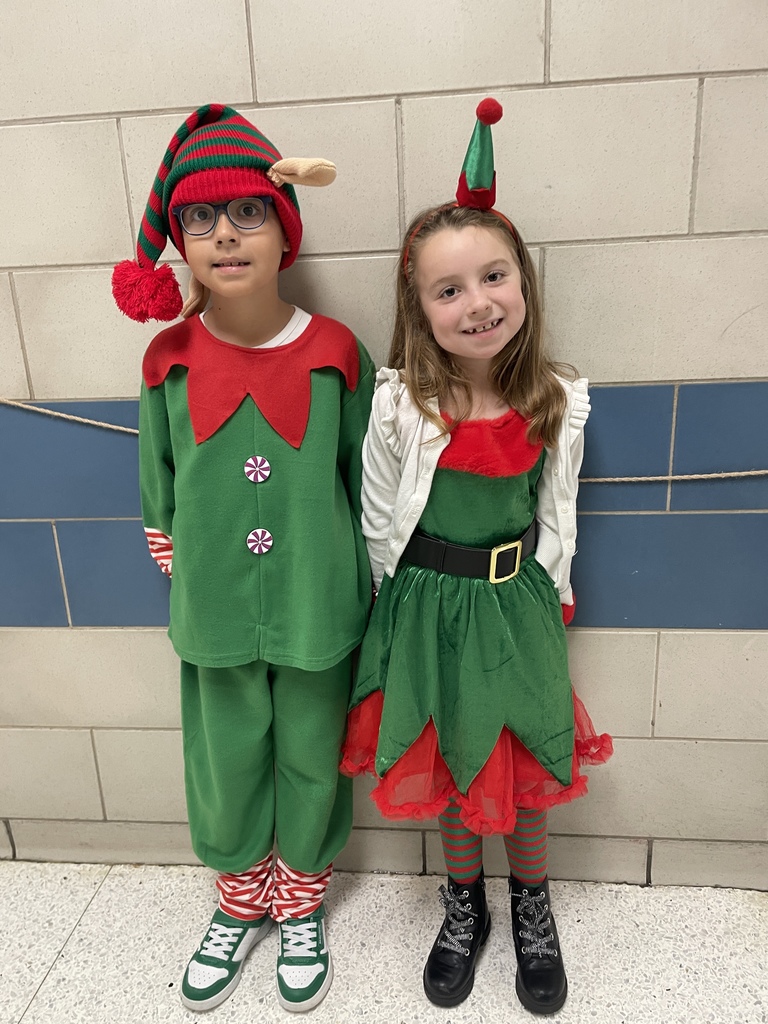 "Selfie with an Elfie! Our halls are officially under elf surveillance today! From sparkly sequins to striped socks, our students and staff definitely understood the assignment. We love seeing so much creativity and joy walking through the school!  Reminder: Don't forget that tomorrow is Rudolph/Reindeer Day!