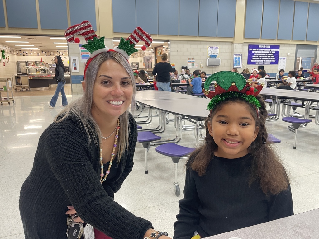 "Selfie with an Elfie! Our halls are officially under elf surveillance today! From sparkly sequins to striped socks, our students and staff definitely understood the assignment. We love seeing so much creativity and joy walking through the school!  Reminder: Don't forget that tomorrow is Rudolph/Reindeer Day!