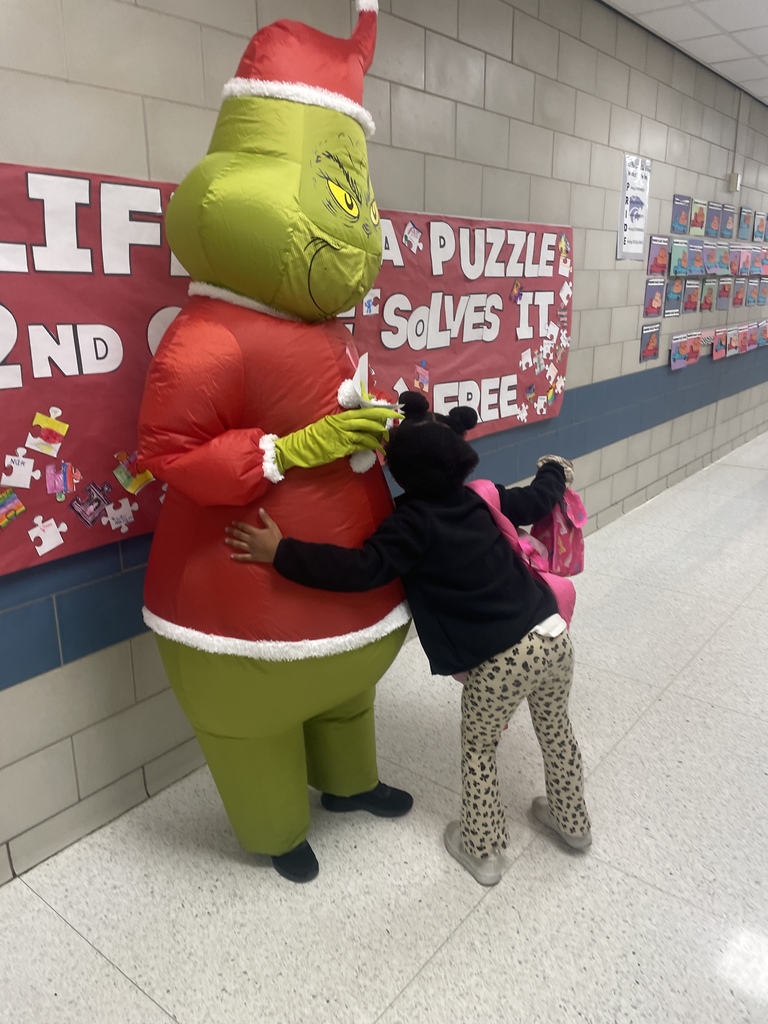 Grinch Day Shenanigans!  It looks like the Grinch's heart didn't shrink after all, because our students brought so much cheer to the school today! We had a fantastic time celebrating Grinch Day with so many creative shirts and costumes. Seeing all these smiles brightens our whole town!  Keeping the holiday spirit rolling:  Monday: Wear your favorite holiday shirt!  Tuesday: Candy Cane Day! Rock your red and white!  We love sharing moments like these that show the great things happening daily in our halls!