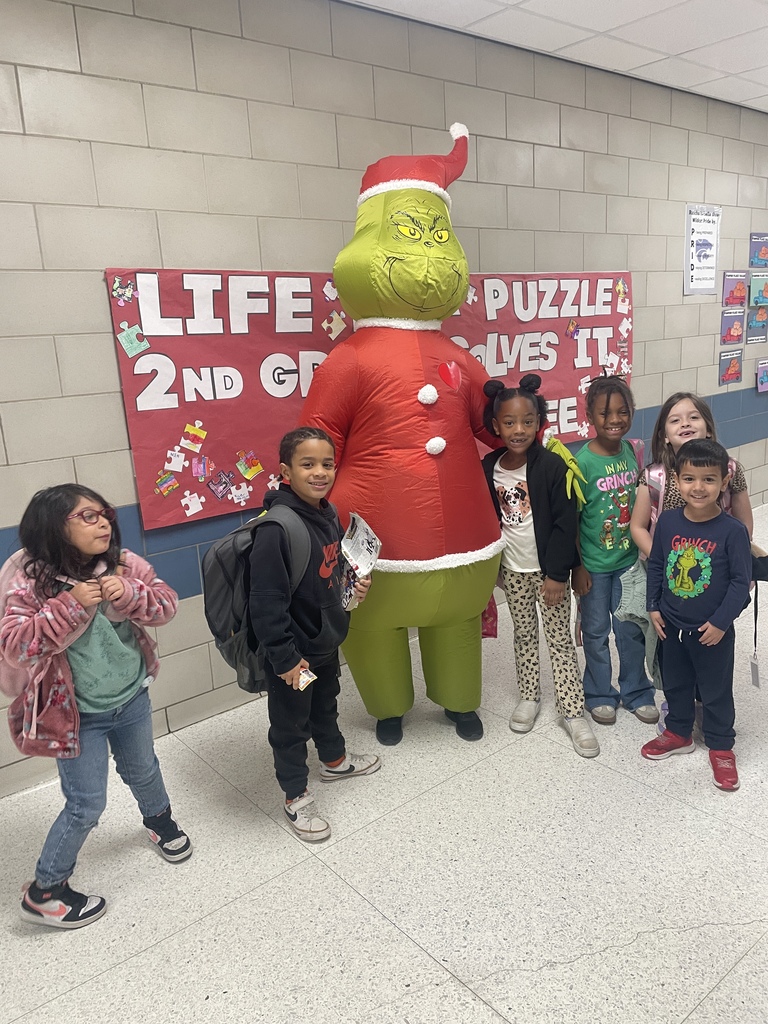 Grinch Day Shenanigans!  It looks like the Grinch's heart didn't shrink after all, because our students brought so much cheer to the school today! We had a fantastic time celebrating Grinch Day with so many creative shirts and costumes. Seeing all these smiles brightens our whole town!  Keeping the holiday spirit rolling:  Monday: Wear your favorite holiday shirt!  Tuesday: Candy Cane Day! Rock your red and white!  We love sharing moments like these that show the great things happening daily in our halls!