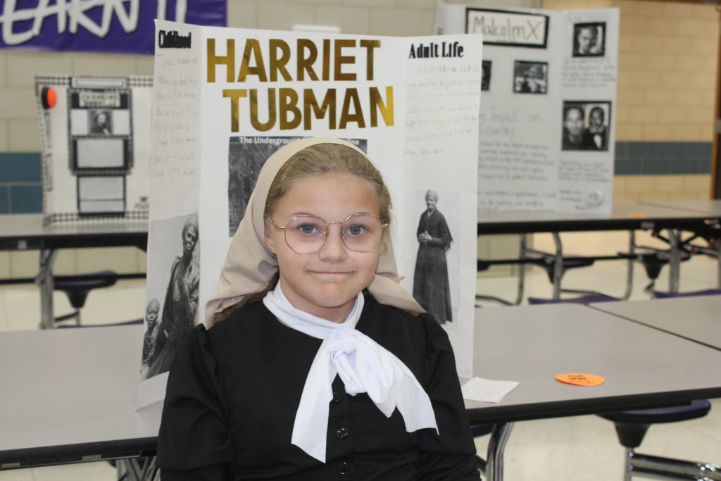 Our 5th graders transformed our cafeteria into a Living Wax Museum today in honor of Black History Month.  Visitors had to find the "magic button" at each station to bring these historical icons to life. Once "activated," students stepped out of their wax-like poses to share powerful stories—in character!—about leaders like John Lewis, Ruby Bridges, and Malcolm X.  Seeing our students take such pride in their research and public speaking was the highlight of our week! 🌟