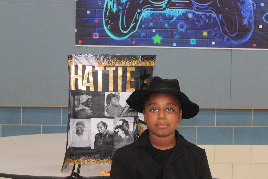 Our 5th graders transformed our cafeteria into a Living Wax Museum today in honor of Black History Month.  Visitors had to find the "magic button" at each station to bring these historical icons to life. Once "activated," students stepped out of their wax-like poses to share powerful stories—in character!—about leaders like John Lewis, Ruby Bridges, and Malcolm X.  Seeing our students take such pride in their research and public speaking was the highlight of our week! 🌟