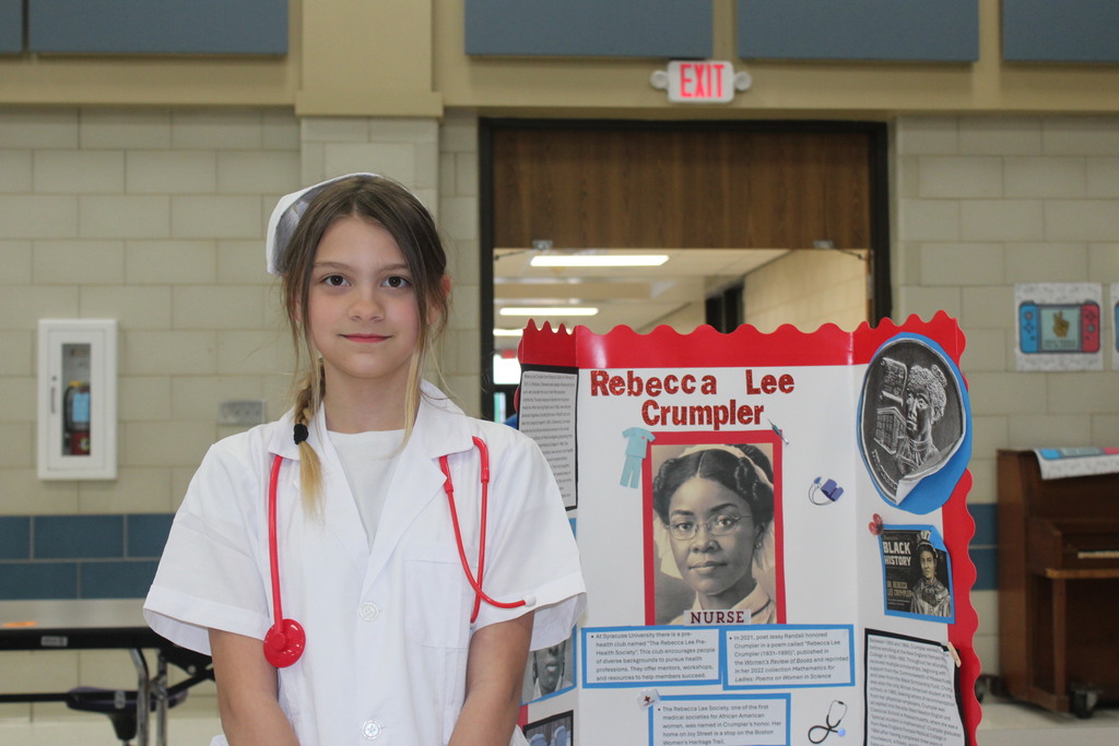 Our 5th graders transformed our cafeteria into a Living Wax Museum today in honor of Black History Month.  Visitors had to find the "magic button" at each station to bring these historical icons to life. Once "activated," students stepped out of their wax-like poses to share powerful stories—in character!—about leaders like John Lewis, Ruby Bridges, and Malcolm X.  Seeing our students take such pride in their research and public speaking was the highlight of our week! 🌟
