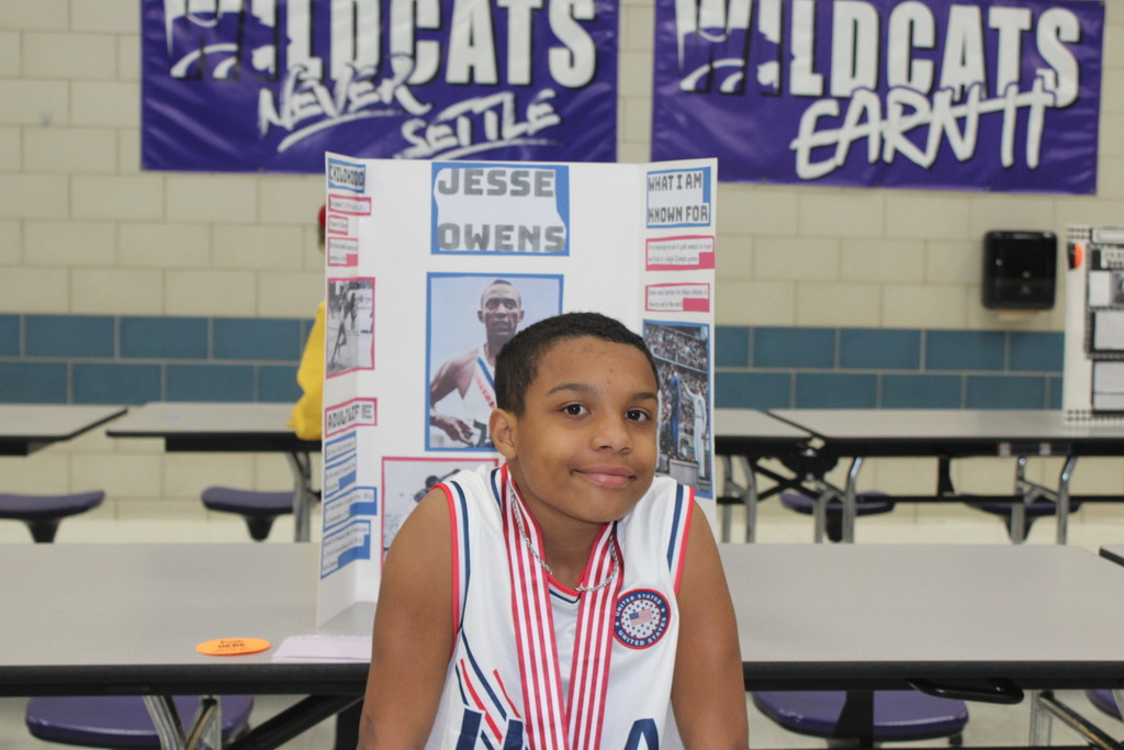 Our 5th graders transformed our cafeteria into a Living Wax Museum today in honor of Black History Month.  Visitors had to find the "magic button" at each station to bring these historical icons to life. Once "activated," students stepped out of their wax-like poses to share powerful stories—in character!—about leaders like John Lewis, Ruby Bridges, and Malcolm X.  Seeing our students take such pride in their research and public speaking was the highlight of our week! 🌟