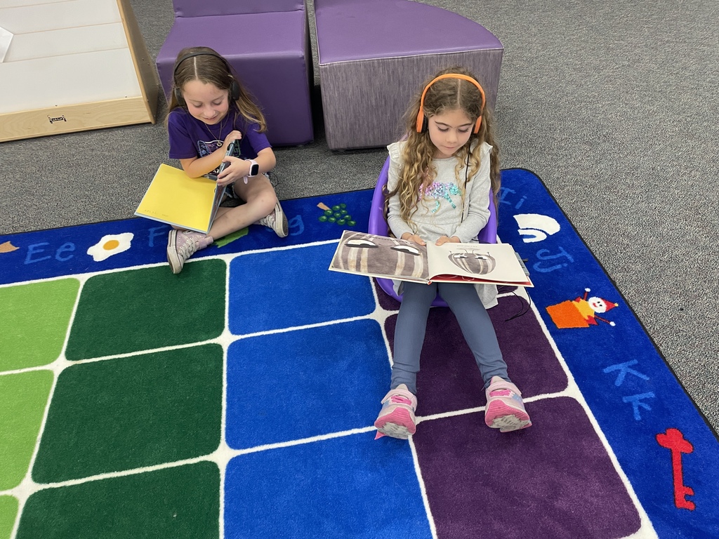 Big things are happening in our library! We are so excited to introduce our brand-new VOX Books! These "books that talk" allow our students to listen to a professional narration while they follow along with the physical pages, helping to boost literacy and confidence.  This was made possible through a wonderful partnership between Mrs. Kluttz and our Librarian, Mrs. Powell, who successfully applied for a grant through the Education Foundation.  Check out these photos from our "Launch Day!" A few lucky students were selected to be our "First Listeners" and official product testers. From the smiles on their faces, we think these books are going to be a huge hit!