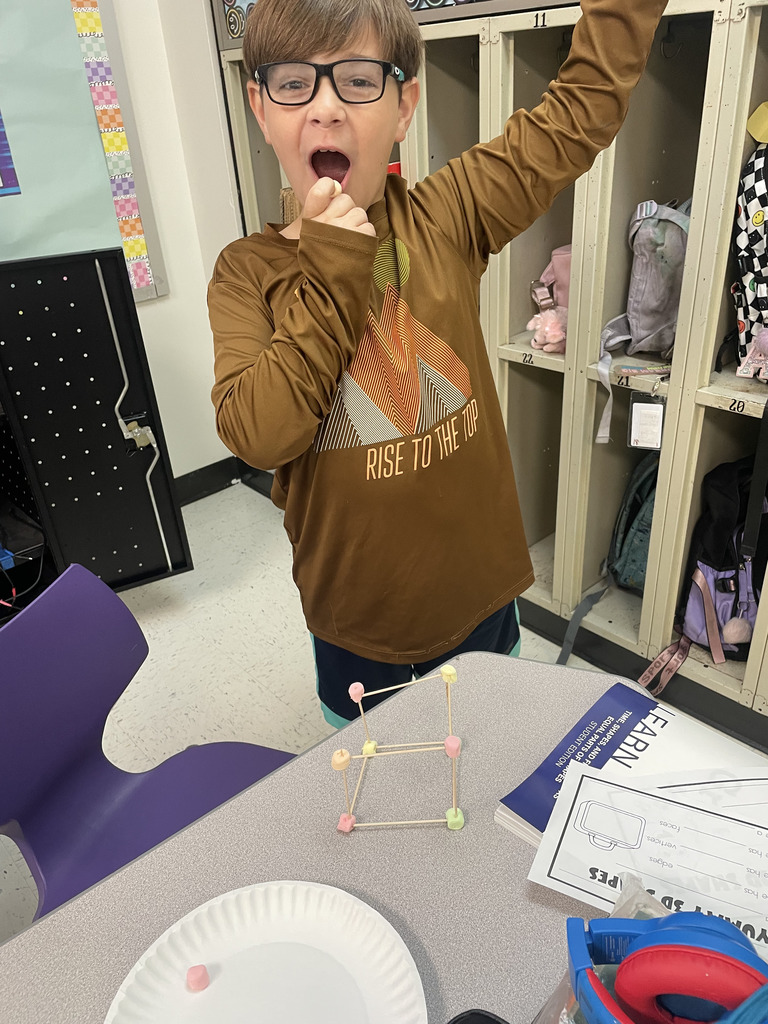 Engineering or snacking? In Mrs. Aaron’s 2nd-grade math class, it’s a bit of both! Our students are moving beyond the textbook to build 2D and 3D shapes from the ground up. By using marshmallows and toothpicks to represent vertices and edges, these young mathematicians are gaining a deeper understanding of geometric properties. Way to go, Grade 2!