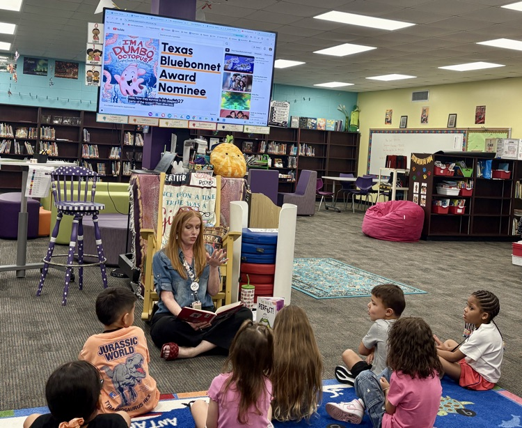 Gathered around for a good book during library!