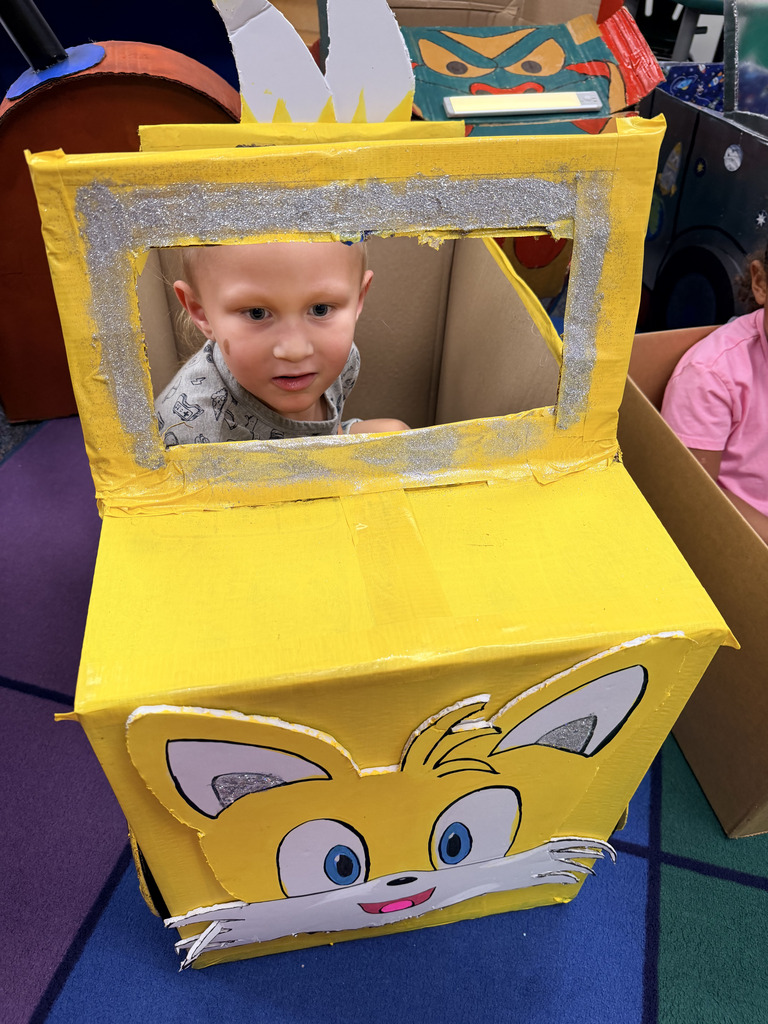 Our Pre-K students finished up their box unit in the most creative way possible! The kids brought their hand-crafted cardboard cars to class and parked them in the classroom for a special drive-in movie day. We love seeing their big smiles and incredible imaginations come to life!