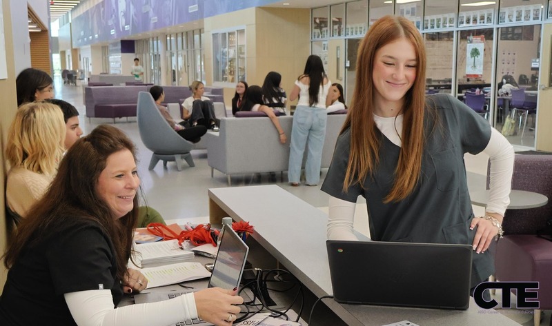 Health Science student checks in blood donors