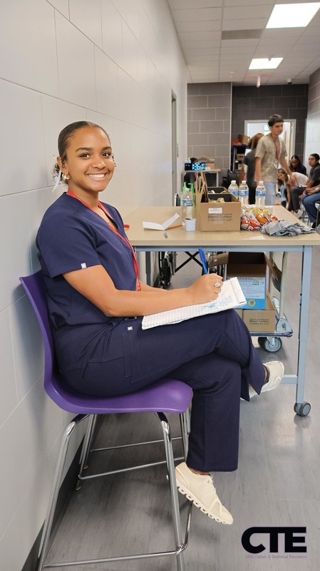 Health Science student records vital information at blood drive