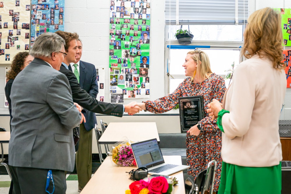 Lyndsay Huerbin receiving award