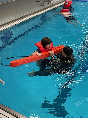 Student practicing rescue techniques.