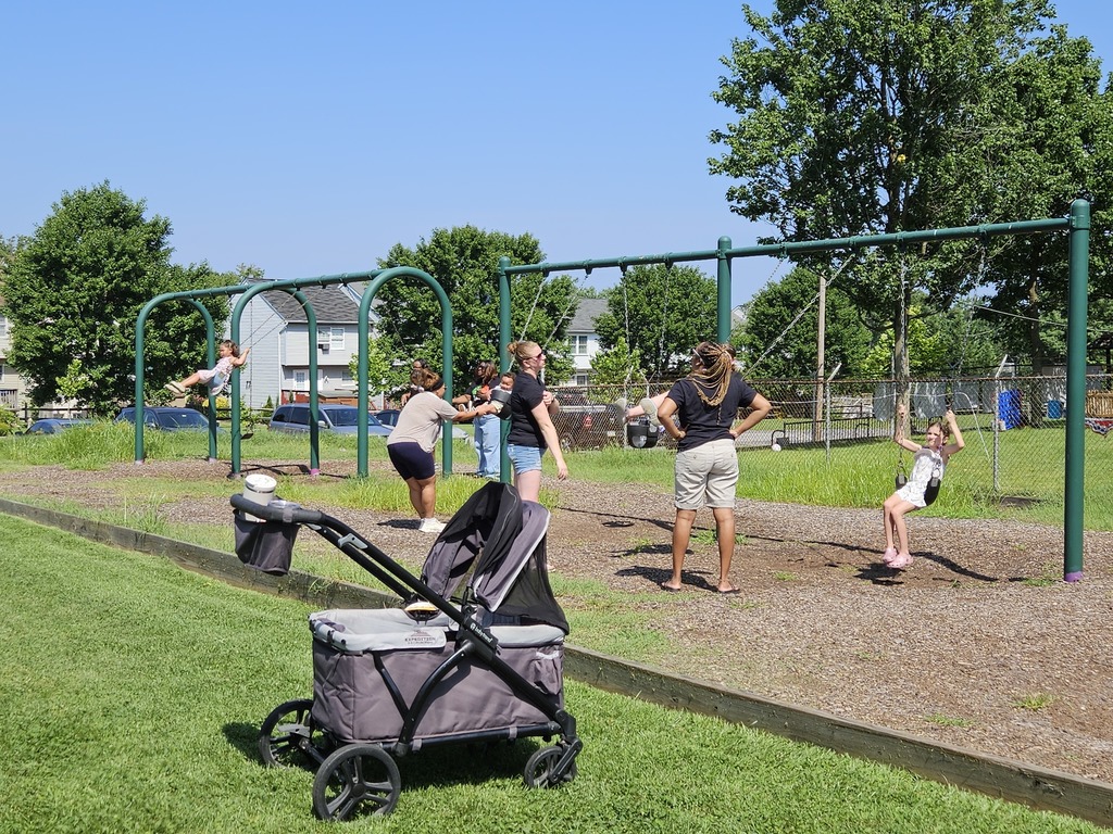 families enjoying swing