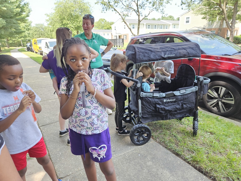 families enjoying popsicles