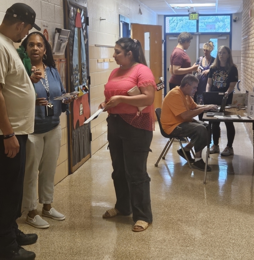 staff talking to parents