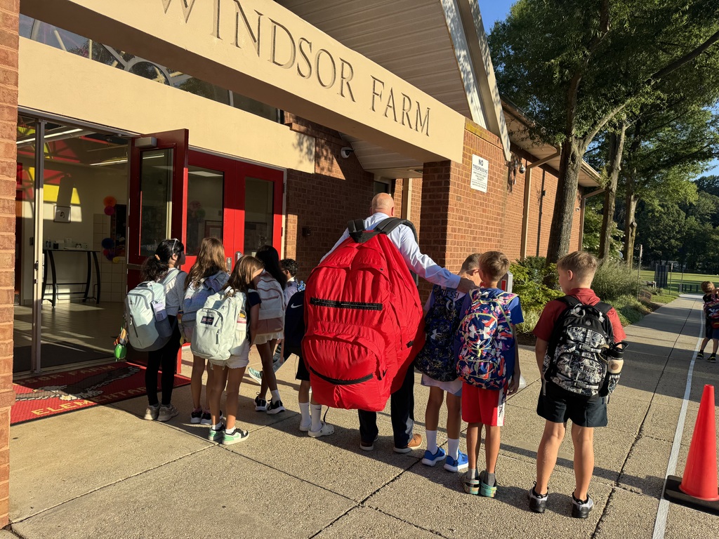 Students showing off their schoolbags