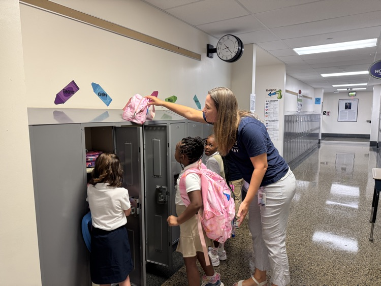 teacher with students at lockers