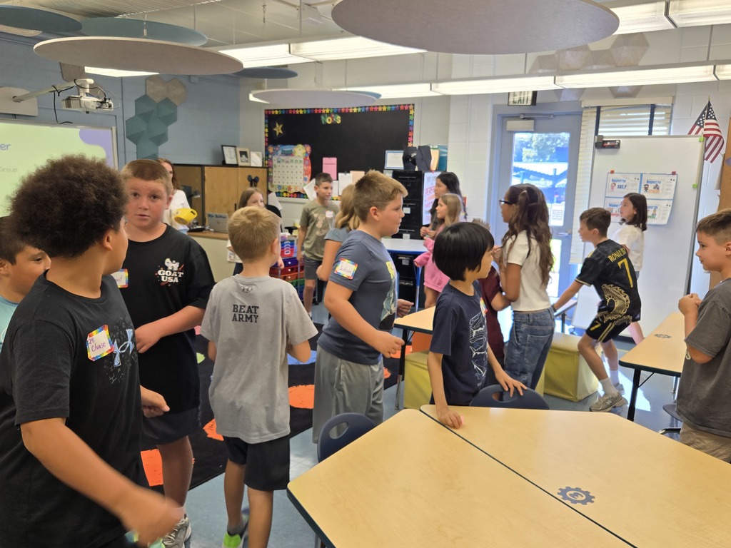 Students in groups talking 