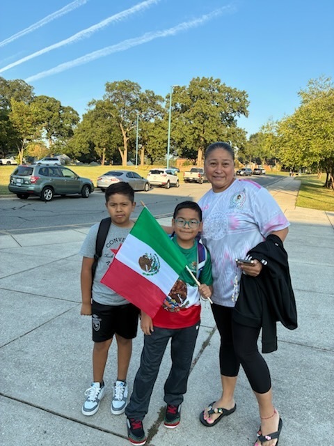 Parents and students with flag