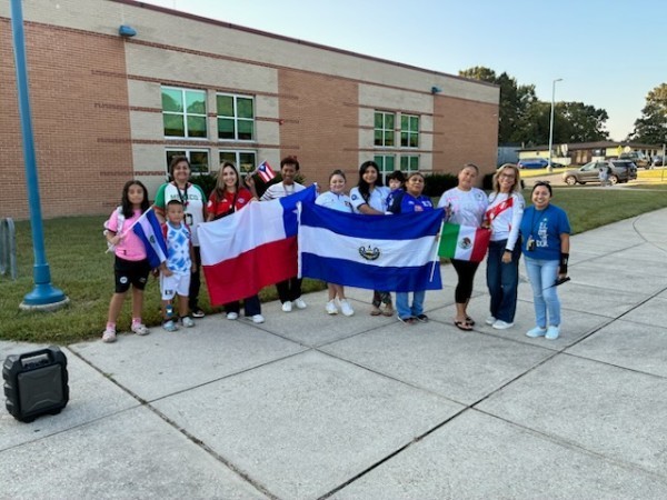 Parents and staff with flags