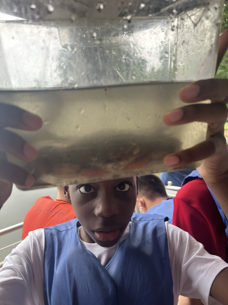 student holding crab 