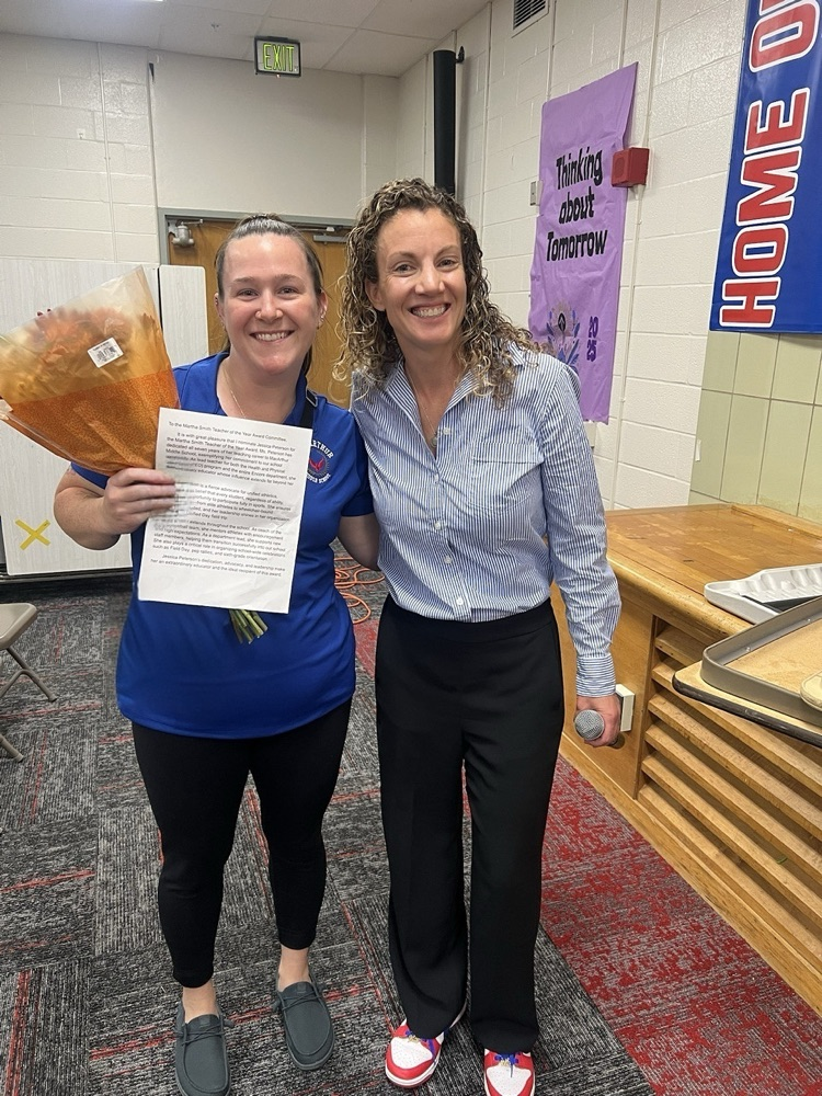 ms Peterson being presented with nominee from ms mcvey 