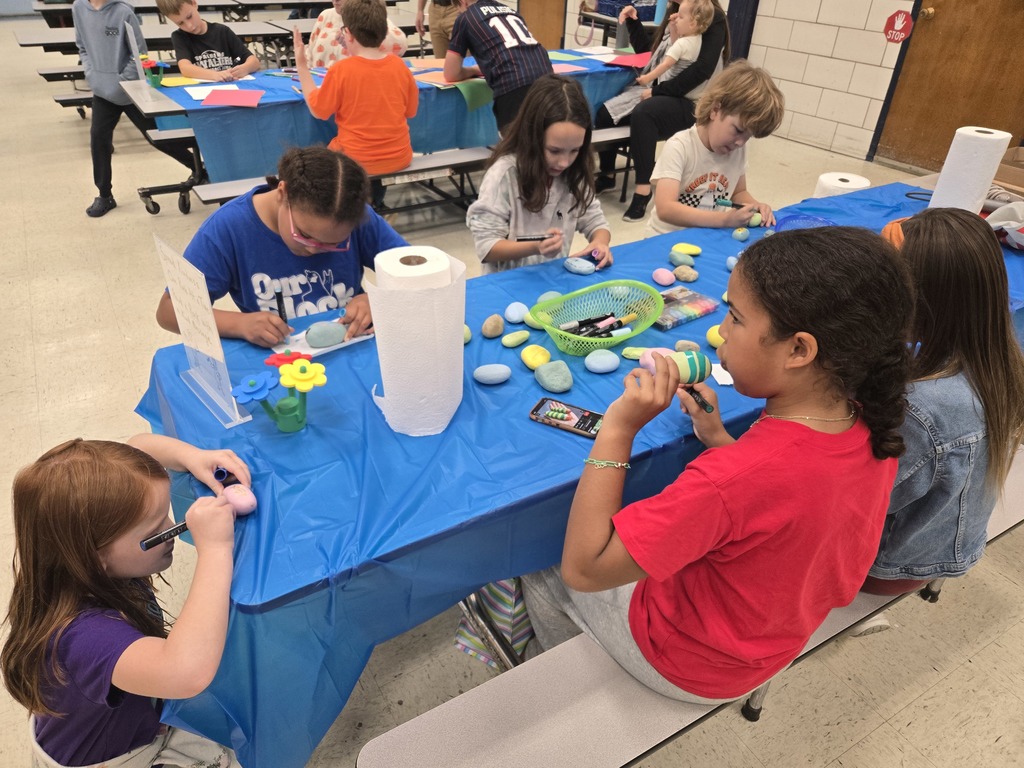 Students making kindness rocks.