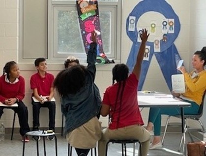 Parent volunteer teaching a lesson