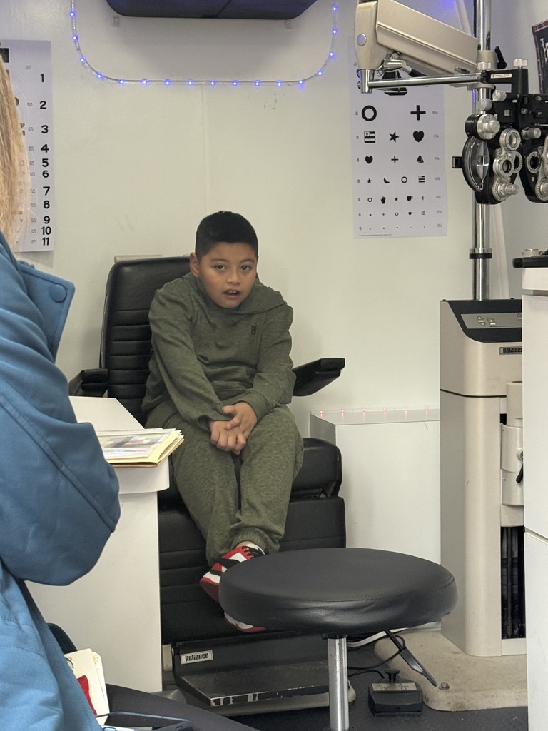 Student waiting to begin eye exam