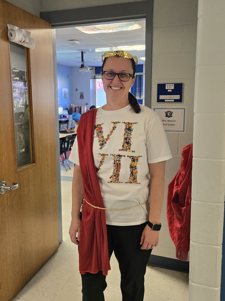 Teacher in a Cape with crown.