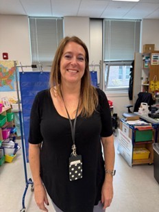 Picture of Ms. Muir that help apply and earn the Walmart grant.