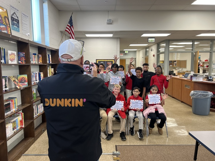 dunkin taking a picture of soar students 