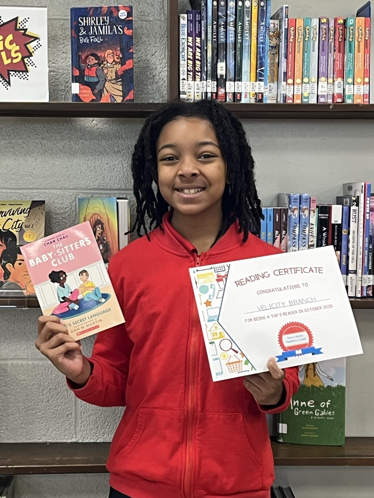 reader with her certificate and free book