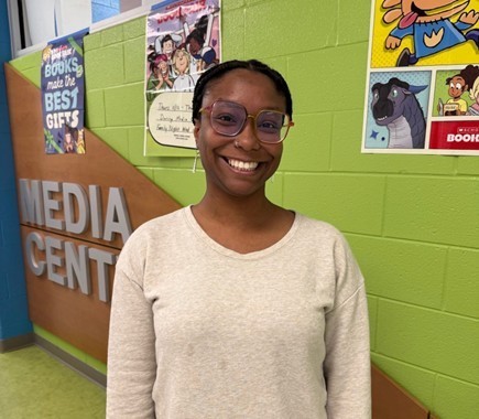 Photo of Ms. Perry in the hallway.